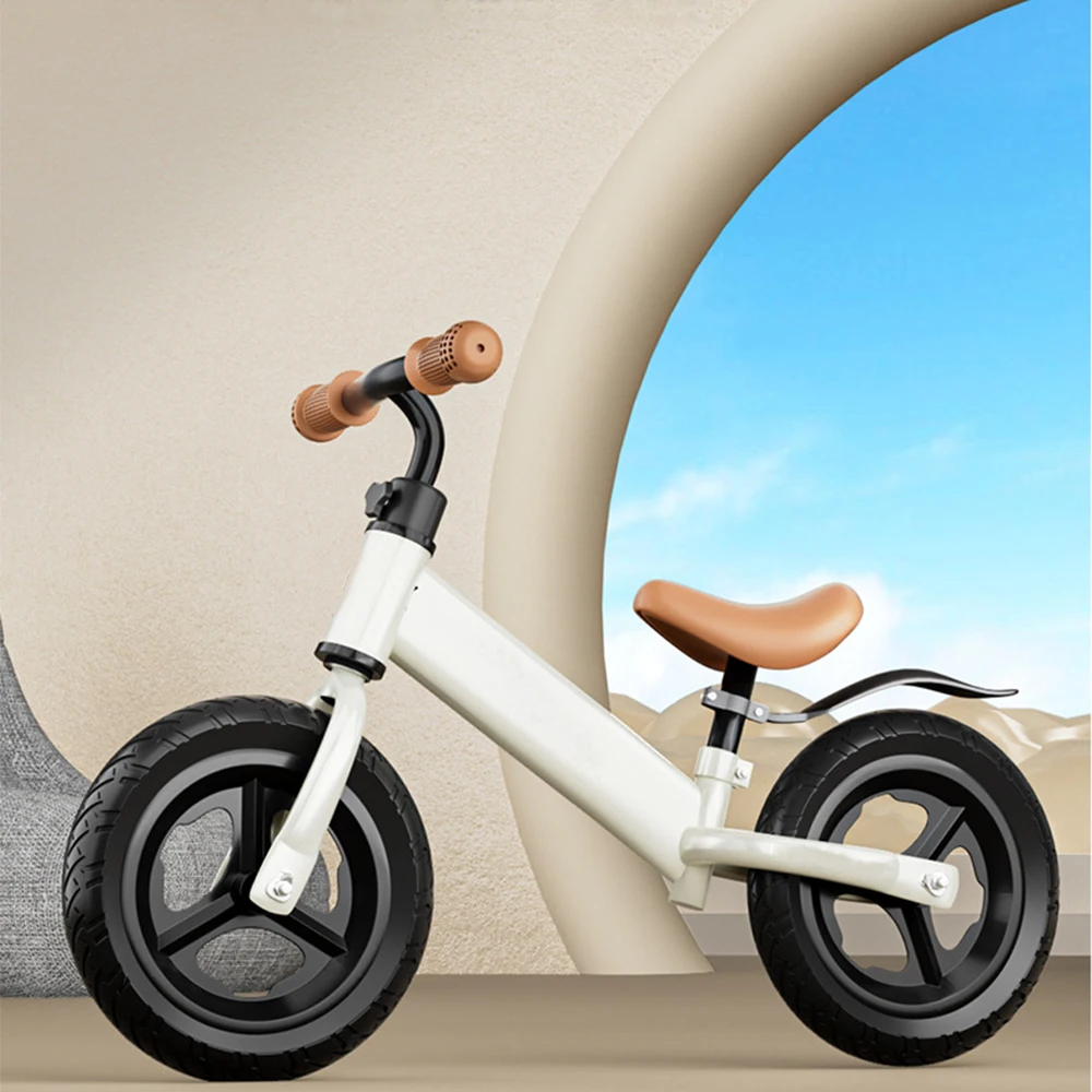 Vélo d'équilibre léger pour enfants 26 ans sans pédales cadre métal poignées caramel design moderne pneus caou