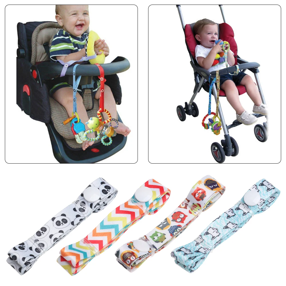 Adaptateur jouet poussette antiéchappement multifonction polyester motifs variés fixations sécurisées