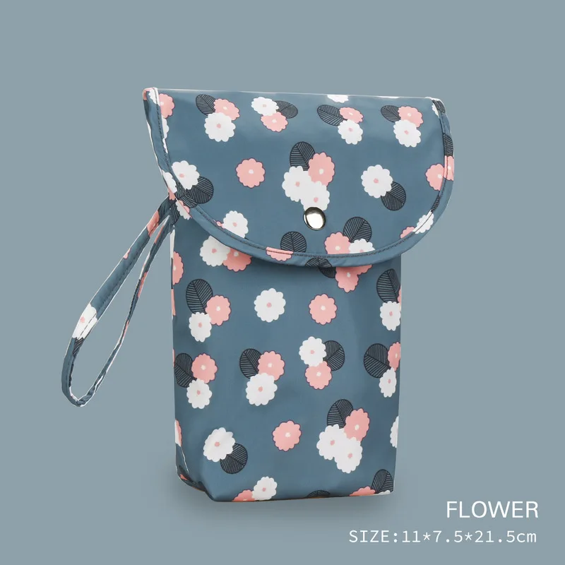 Sac à langer bébé floral imperméable design moderne boutonpression poignée matériau synthétique rangement prat