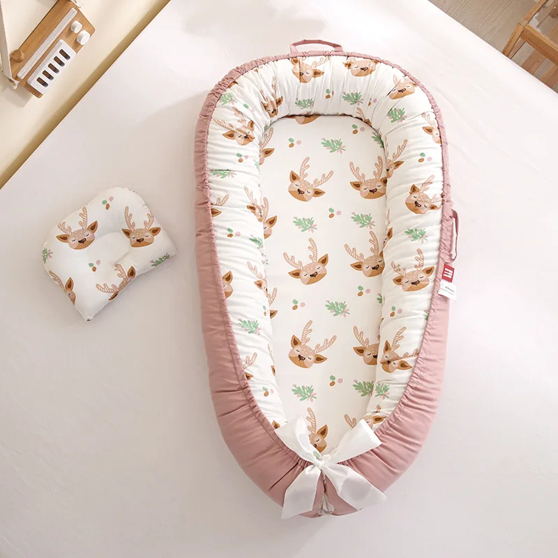 Berceau portable bébé rose blush nid doux avec motifs animaliers lit de voyage confortable pour chambre d'enfa