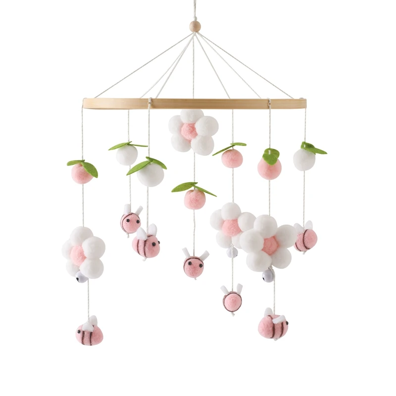 Mobile bébé nature jouet apaisant chambre enfant déco bois pompons feutre abeilles fleurs couleurs douces évei