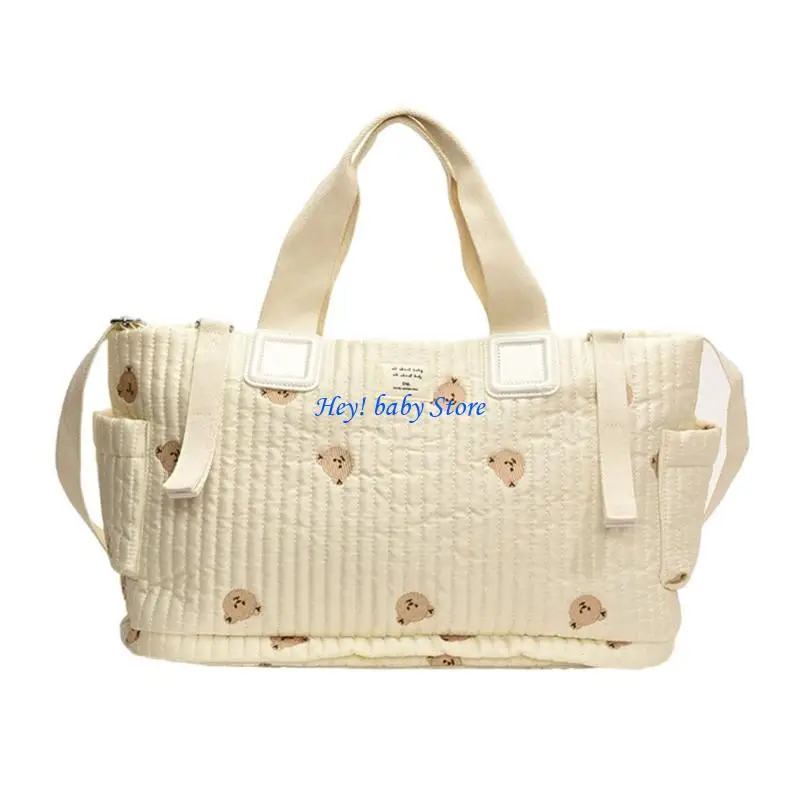 Sac à langer matelassé en tissu beige avec motifs nounours Poche extérieure et fermeture éclair Conçu pour mam
