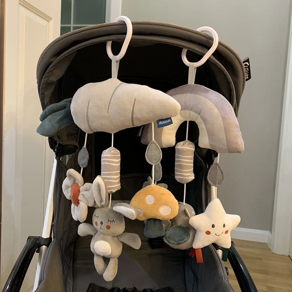 Mobile pour poussette bébé jouets suspendus peluches éducatives 刺激 sensoriels cadeau nouveauné design moderne