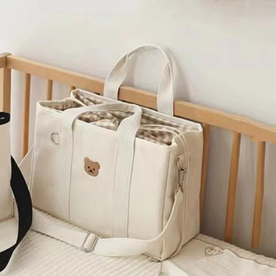 Sac à langer maternité portage bébé sac main poussette style moderne tissu doux compartiments sécurisés sangle