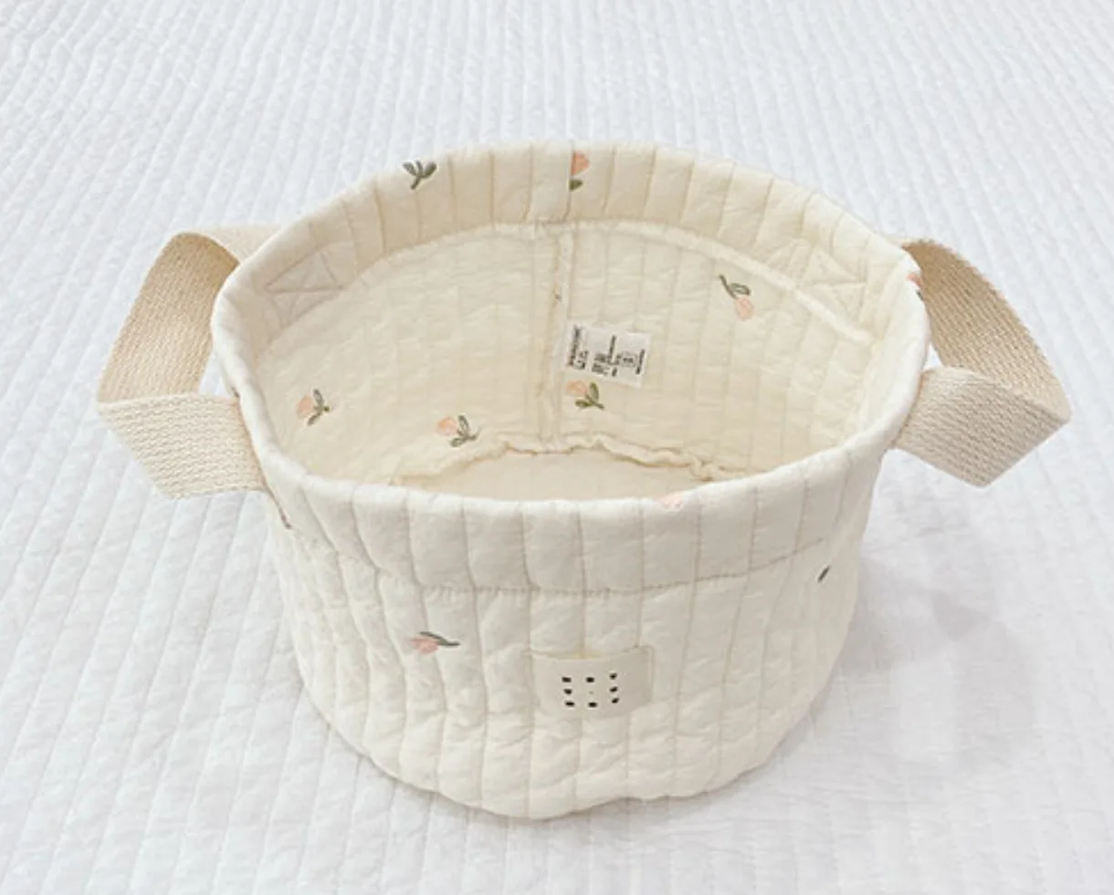 Panier de rangement bébé en coton doux design floral pastel anses robustes organisation chambre bébé lit jouet