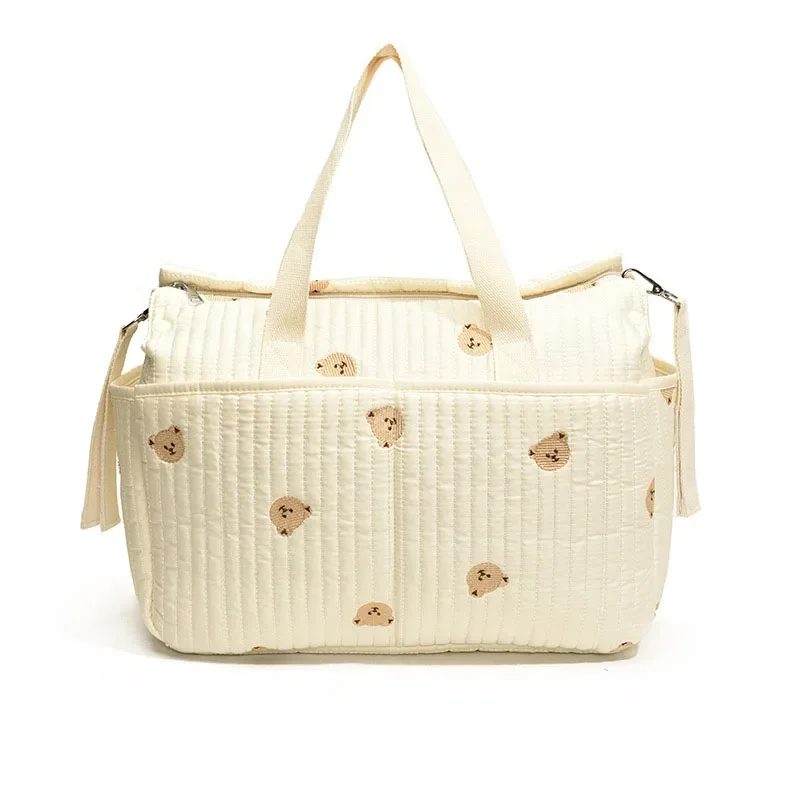 Sac à main bébé MUNIBag grande capacité ours brodé portable poussette sac à langer beige clair design ludique 