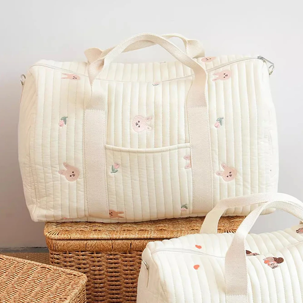 Sac à couches bébé organisateur brodé sac de voyage mignon design enfantin tissu matelassé poche pression idéa