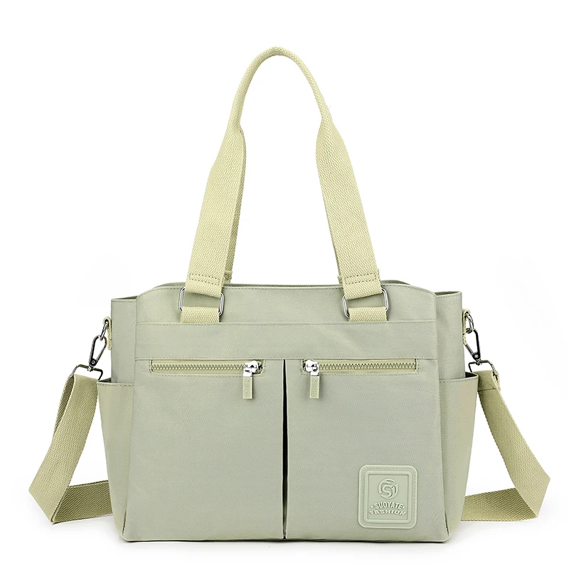 Sac fourretout grande capacité vert pâle nylon bandoulière ajustable poches zippées usage quotidien voyages du