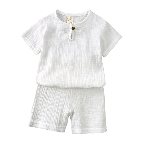 Ensemble vêtements enfant Koi Fairy 2 pièces short shirt coton gaufré blanc style minimaliste bouton bois bébé
