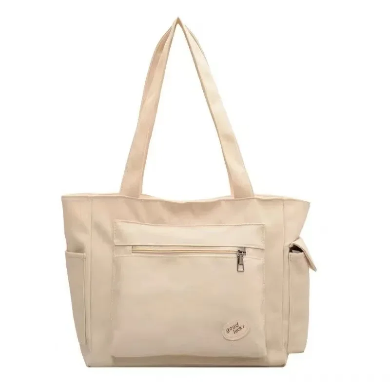 Sac à dos en polyester avec poche zippée design minimaliste idéal pour les courses et le quotidien