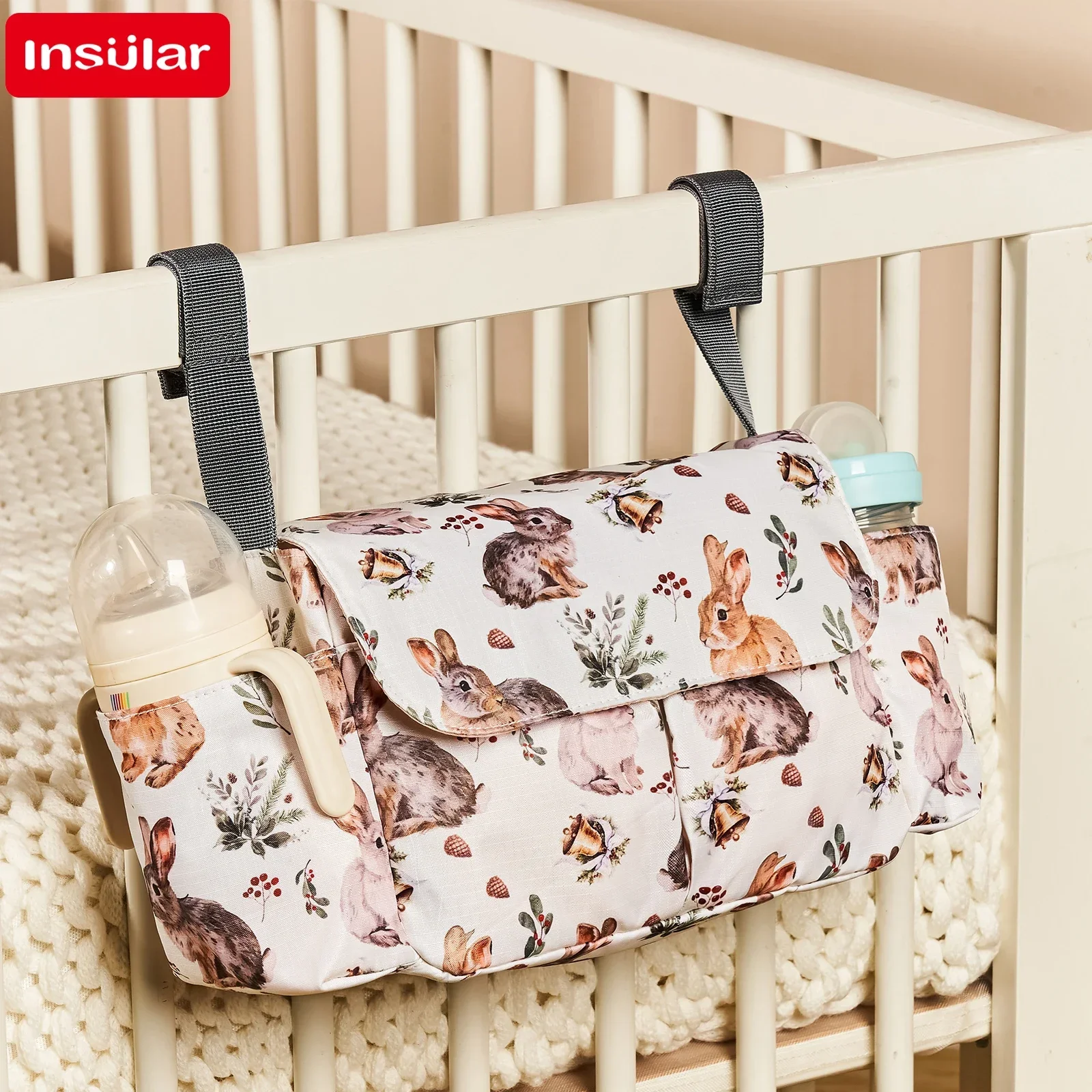 Organisateur de lit bébé Insular accessoires de berceau stockage bébé rangement biberons couches jouets design