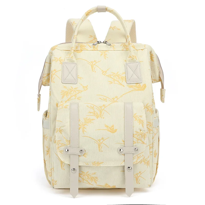 Sac à dos maman multifonctionnel maternité pratique élégant tissu côtelé floral beige jaune accessoires inclus