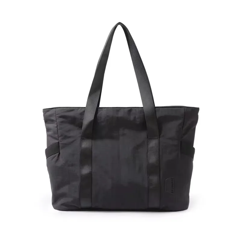 Sac fourretout voyage universel design minimaliste polyester résistant poches latérales transport facile sac à