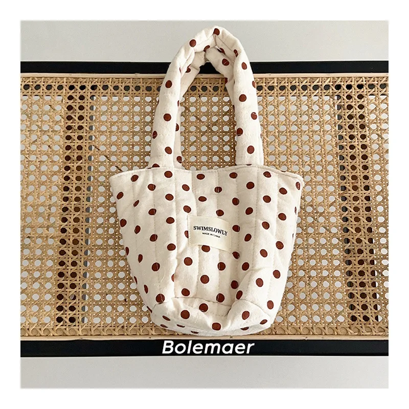 Sac à langer en tissu doux crème et marron grande capacité anses robustes design épuré idéal pour maman et béb
