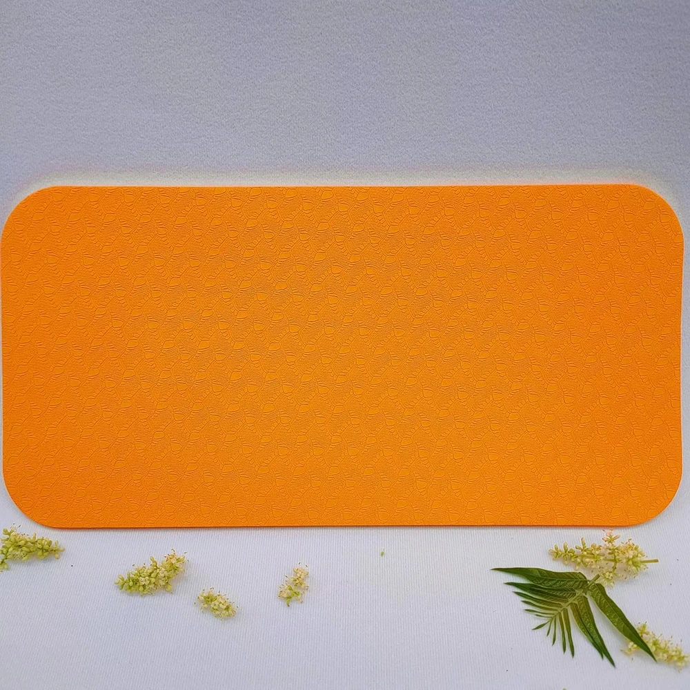 Tapis de yoga antidérapant orange 34x17cm surface embossée confortable intérieur moderne accessoire déco usage