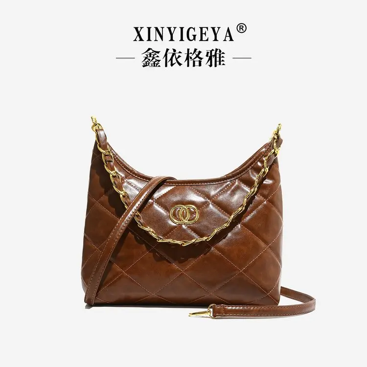 Sac à main vintage maroquinerie élégant design minimaliste cuir couleur marron richesse accessoire mode femme 