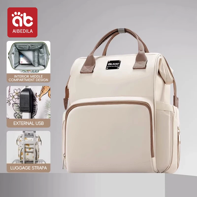 Sac à dos bébé multifonctionnel AIBEDILA sac à couches léger avec USB design moderne pratique pour maman style