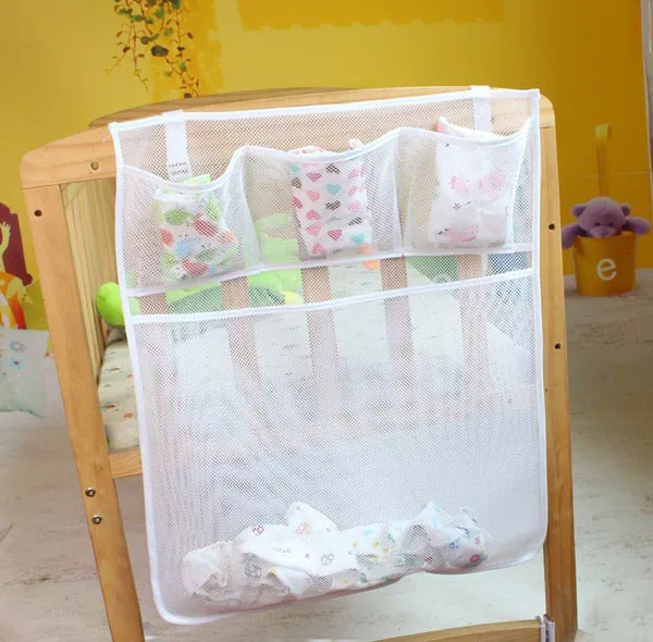 Organisateur de lit bébé tissu maille poches multicolores rangement pour couches jouets design moderne fonctio