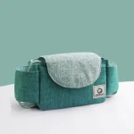 Sac à langer pour poussette organizer bébé rangement pratique design moderne couleur turquoise et gris accessoires de voyage portefeuille maman idéal maternité