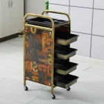Chariot de rangement 4 tiroirs structure métal doré tiroirs plastique noir design vintage industriel usage salon ou domestique