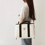 Sac à couches bébé sac maternité maman sac main poussette mère enfant design minimaliste motif ours tendance couleur blanche noire