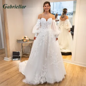 Robe de mariée fantaisie Gabriellar manches bouffantes détachables lacing plis appliqués personnalisée polyester tulle Robe de mariée fantaisie Gabriellar manches bouffantes détachables lacing plis appliqués personnalisée polyester tulle