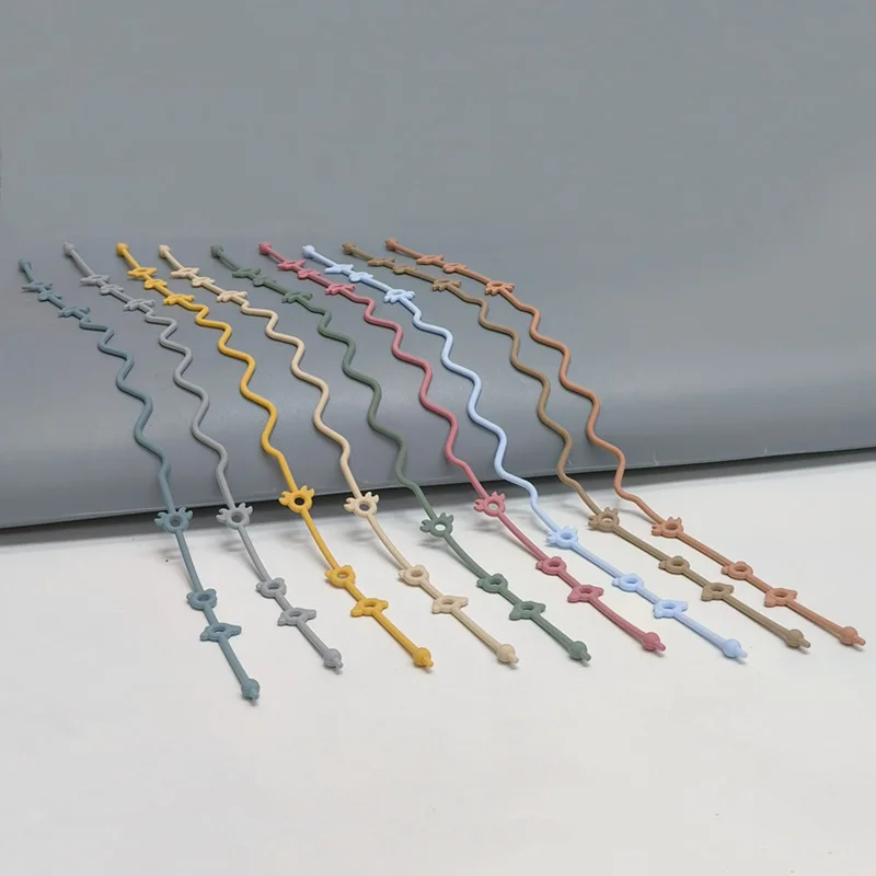 Attache accessoire poussette landau bébé support silicone sangle portebouteille accessoire de fixation universel multicolore design moderne