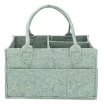 Caddie à couches bébé organisateur rangement couches lingettes usage voiture et maison panier feutre compartiments poches latérales couleur vert pâle design épuré écolo