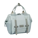 Sac à dos multifonctionnel Qixitu pour maman sac à couches matériau durable grande capacité style moderne bleu clair antiéclaboussures portable entretien facile