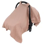 Housse de siège auto bébé en coton protection soleil texture gaufrée rose pâle sangles intégrées design moderne usage quotidien