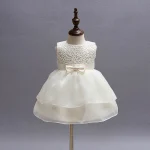 Robe bébé fille 1ère communion blanche sans manches dentelle fleur nœud satinée occasion spéciale