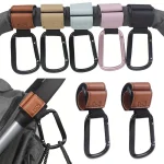 Crochets de poussette multifonctionnels en similicuir 4 coloris fixation élastique accessoires de voyage bébé pratique et sécurisé
