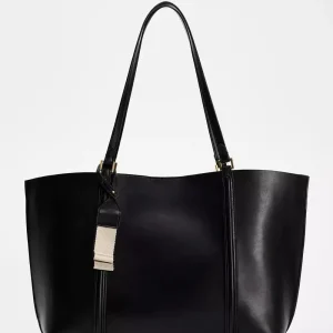 Sac fourretout cuir synthétique minimaliste femme design moderne usage quotidien sac à bandoulière durabilité style épuré idéal pour shopping ou travail
