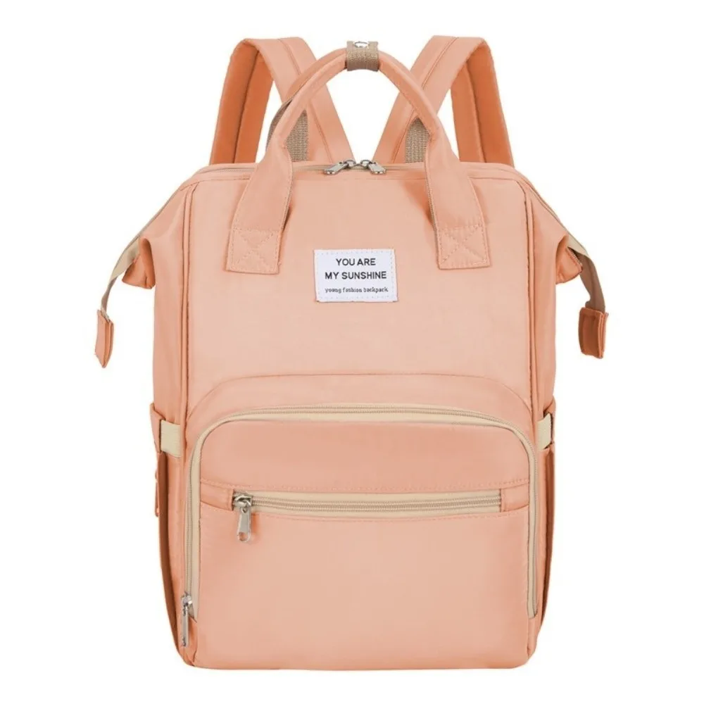 Sac à dos multifonctionnel pour maman portable grande capacité sac de change pour bébé léger et pliable design moderne rose