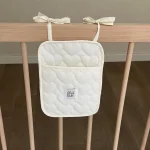 Organisateur mural en tissu matelassé pour bébé sac à langer suspendable rangement pour jouets livres et accessoires bébé style moderne et doux
