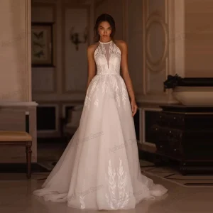 Robe de mariée glamour dentelle sans manches dos nu licou train longueur sol Robe de mariée glamour dentelle sans manches dos nu licou train longueur sol