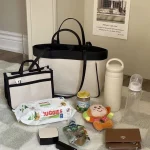 MILANCEL Sac spinal grande capacité poche intérieure sac à couches portable multifonction bébé maman démarrage unique  noir