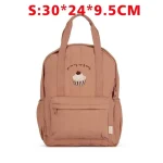 Sac à dos enfant mode automne 2025 design cupcake confortable et sécuritaire pour école et loisirs