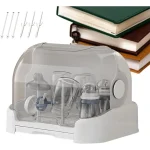 Stérilisateur de biberons en plastique transparent design moderne sécuritaire compact pour la cuisine ou la salle de bain facilitant la désinfection et le rangement des accessoires bébé