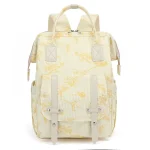 Sac à dos maman multifonctionnel maternité pratique élégant tissu côtelé floral beige jaune accessoires inclus design moderne