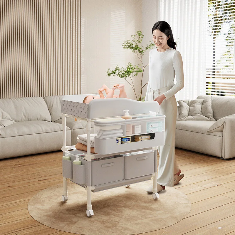 Chariot rangement bébé moderne avec roulettes 多 compartiments tissu et plastique design épuré idéal pour chambre bébé et table à langer