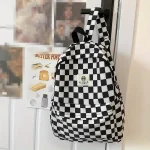 Sac à dos HUOHUO style damier idéal étudiants jeunes professionnels design moderne confortable matériau durable sac à dos école travail