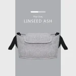 Sac de rangement moderne en tissu synthétique pour poussette sac banane gris lin avec bandoulière noire design minimaliste usage quotidien maternité 036m