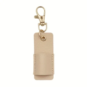 Porteclés cuir beige design moderne clip métal doré pochette repliable anneau portage sécurisé style élégant usage quotidien organisation clés Porteclés cuir beige design moderne clip métal doré pochette repliable anneau portage sécurisé style élégant usage quotidien organisation clés