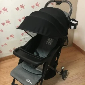 Poussette compacte bébé aluminium tissu noir moderne paresoleil pliable portage urbain pratique