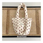 Sac à langer en tissu doux crème et marron grande capacité anses robustes design épuré idéal pour maman et bébé portage confortable style moderne