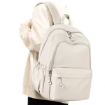 Sac à dos école style moderne minimaliste beige polyester résistant grande capacité sac d&rsquo;école étudiants lycéens transport fonctionnel élégant