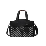 Sac à langer moderne multicompartiments étanche bandoulière détachable pratique pour maman porté main ou épaule style élégant noir et blanc