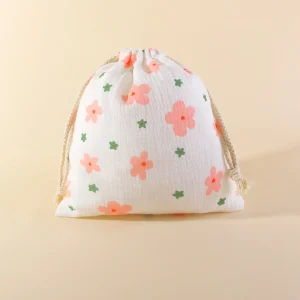 Sac à cordon en mousseline de coton design floral portable rangement polyvalent texture gaufrée idéal pour cosmétiques et accessoires