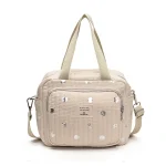 Sac à main maman bébé all about baby design moderne pratique bandoulière ajustable compartiments zippés style élégant universel